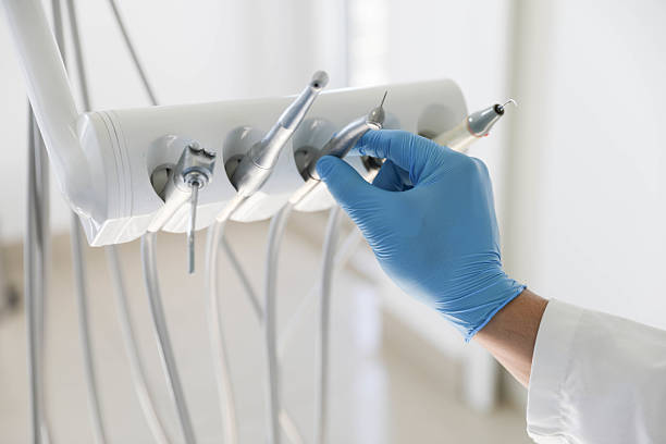 Professional Tooth Extraction technician working in Brunswick, NC